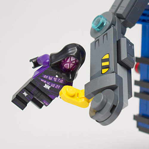 minifigure attached to clamp arm