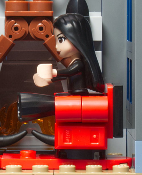 morticia seated in chair