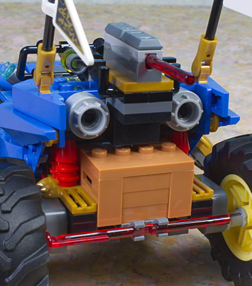 rear view of car with crate and weapon attached