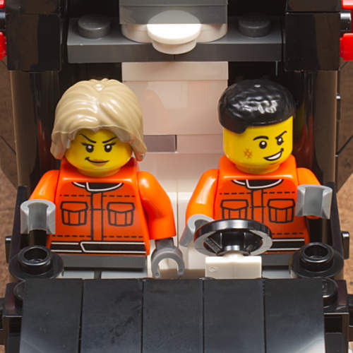 figures seated in cab front view