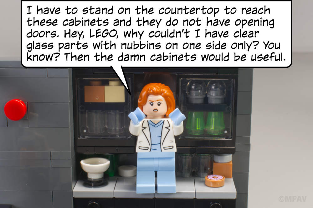 Scully: I have to stand on the countertop to reach these cabinets and they do not have opening doors. Hey, LEGO, why couldn’t I have clear glass parts with nubbins on one side only? You know? Then the damn cabinets would be useful.